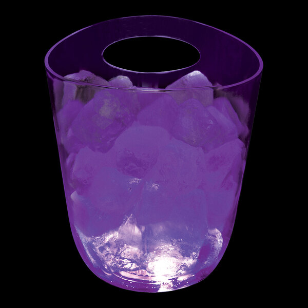 A purple plastic champagne bucket with ice cubes in it.