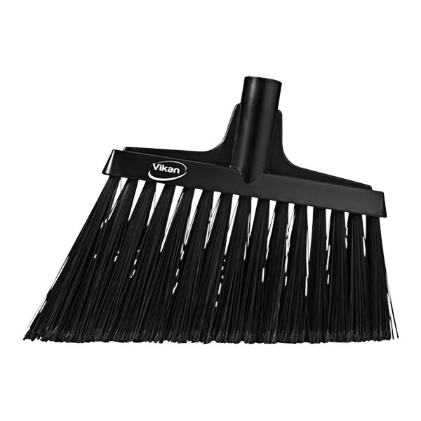 A close-up of a black Vikan angled broom head with flagged bristles.