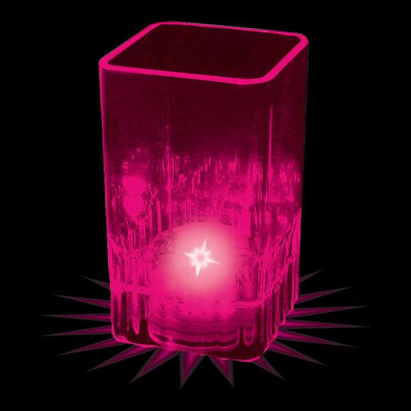 A pink plastic square shot cup with a pink LED light inside.