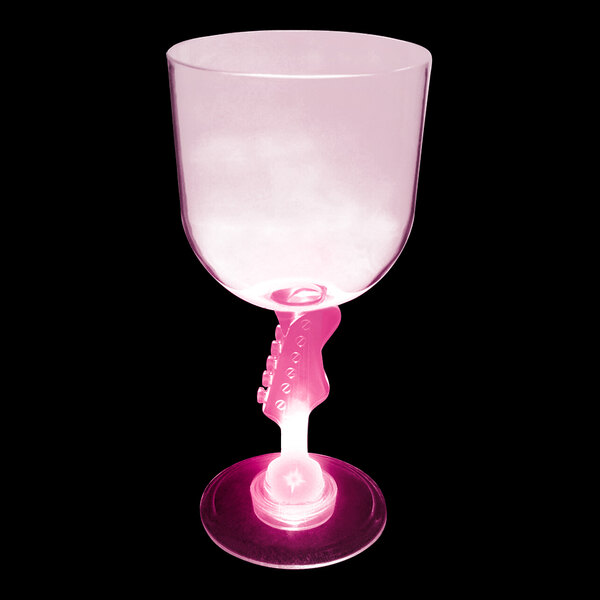 A customizable plastic guitar stem goblet with pink LED light filled with a pink drink.