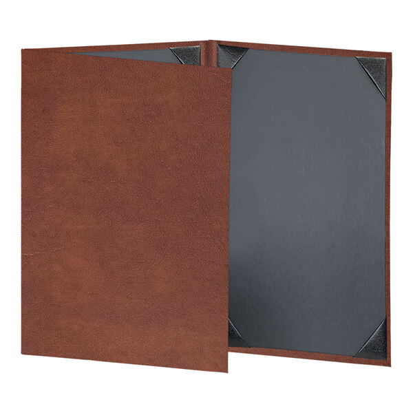 A brown H. Risch, Inc. leather menu cover with black corners on a table.