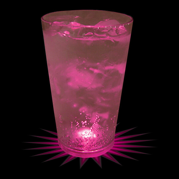 A plastic pint cup with a pink LED light filled with pink liquid and ice.