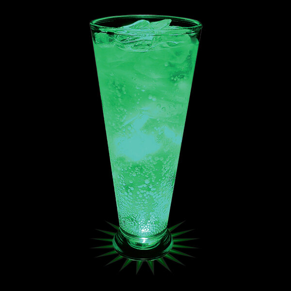 A customizable plastic pilsner cup with a green drink in it.