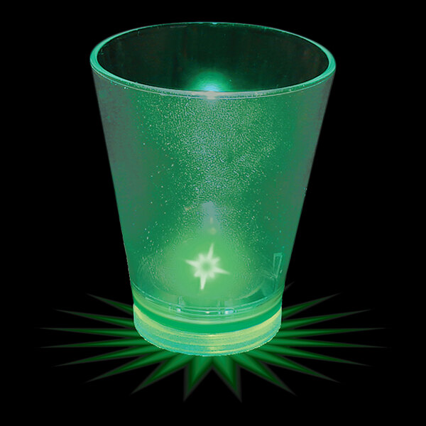 A white customizable plastic shot cup with a green LED light on the bottom.