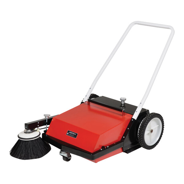 A red and black Vestil belt-driven manual sweeper with a handle and wheels.