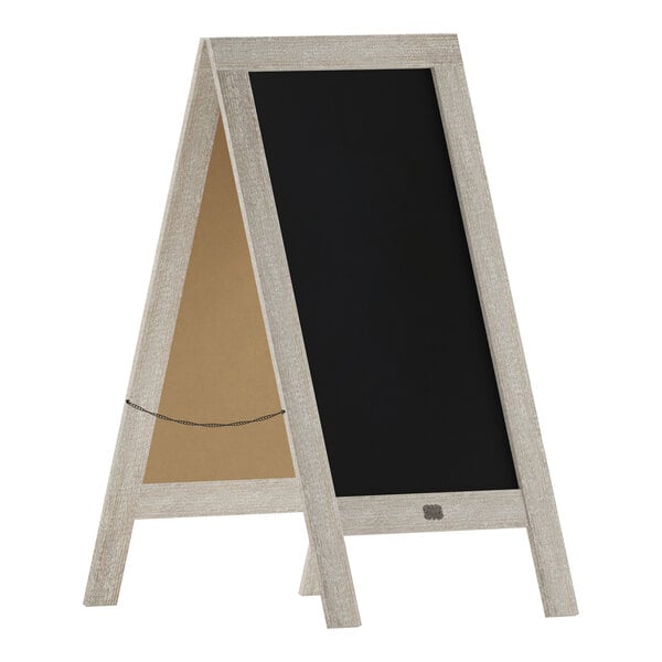 A Flash Furniture A-Frame chalkboard with a weathered wood frame on a table.