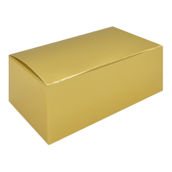 A gold foil candy box with a lid.