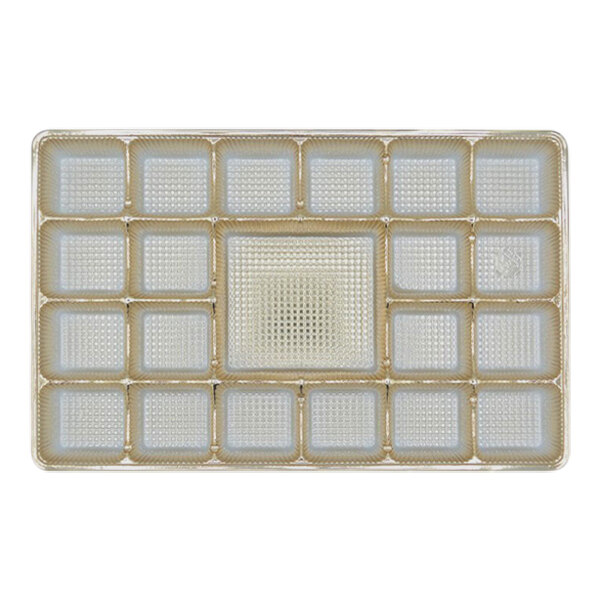 A gold rectangular tray with 21 square cavities.