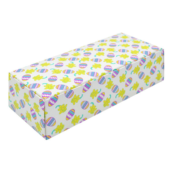 A white rectangular Egg and Daffodil candy box with colorful designs.