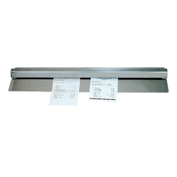 An Advance Tabco aluminum wall mounted ticket holder with two receipts on it.