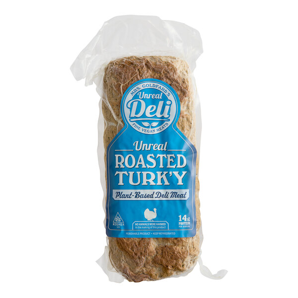 A package of Unreal Deli roasted Turk'y slab on a white background.