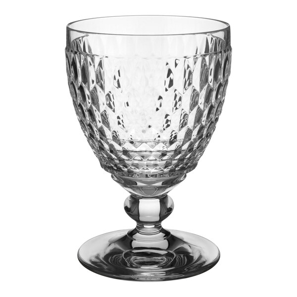 A close-up of a clear Villeroy & Boch Boston wine goblet with a diamond pattern.
