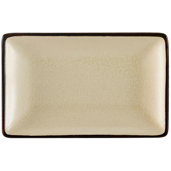 A rectangular creamy white stoneware plate with a black border.
