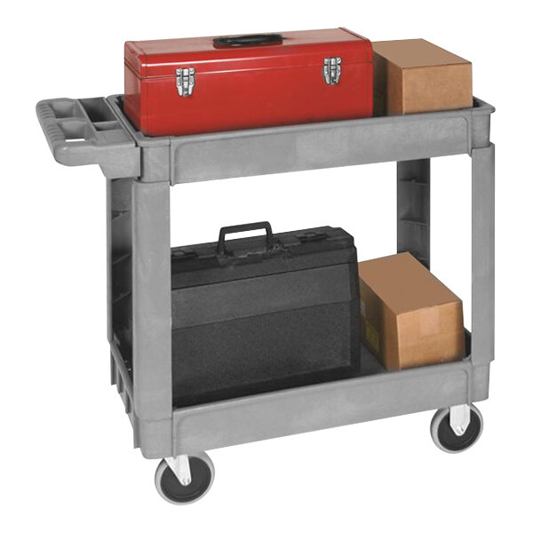 A gray Wesco plastic utility cart with two shelves holding a red toolbox and brown box.