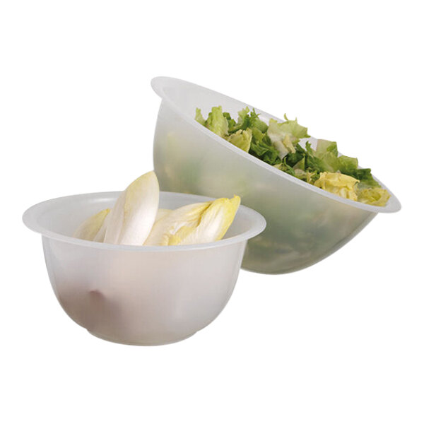 Two Matfer Bourgeat polypropylene mixing bowls with lettuce and endive in them.