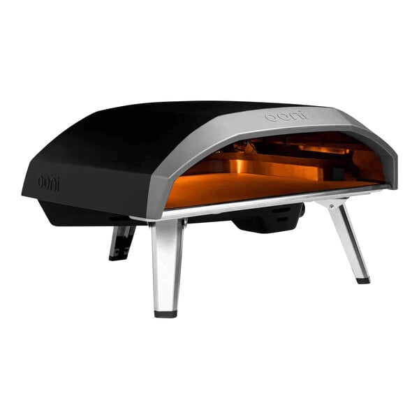 A black and silver Ooni Koda 16 pizza oven with orange accents.