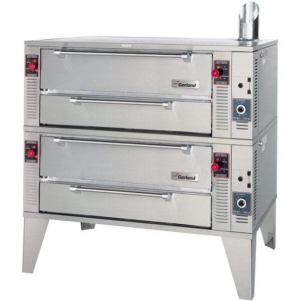 A stainless steel Garland Pyro double deck pizza oven with two doors.