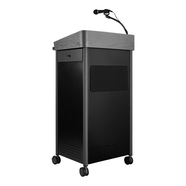 A black Oklahoma Sound lectern with a microphone.