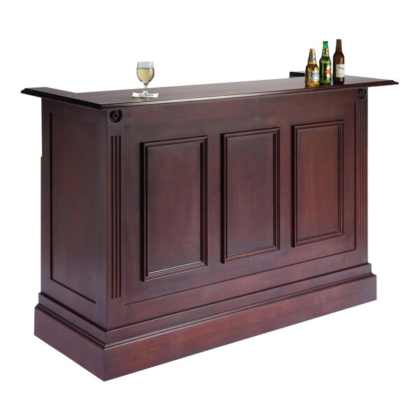 A Lakeside Bernina portable bar with a red mahogany finish and bottles on top of the stainless steel workstation.