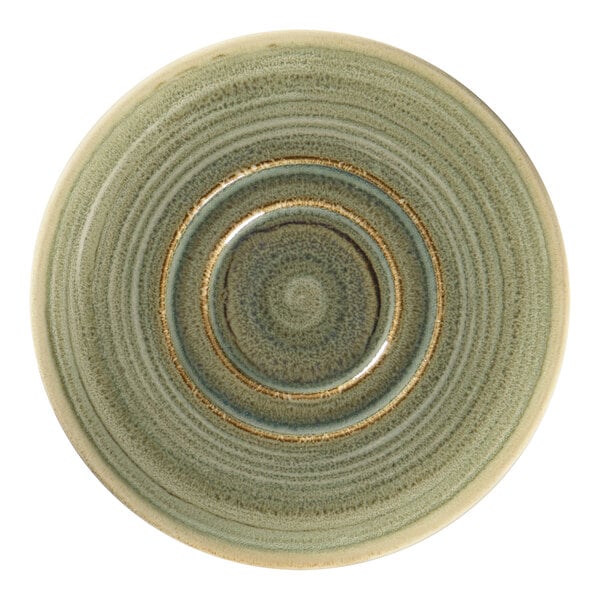 A close-up of a RAK Porcelain emerald green saucer with a circular pattern.