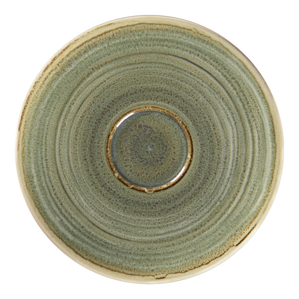 A close-up of a green RAK Porcelain coffee cup saucer with a gold rim.