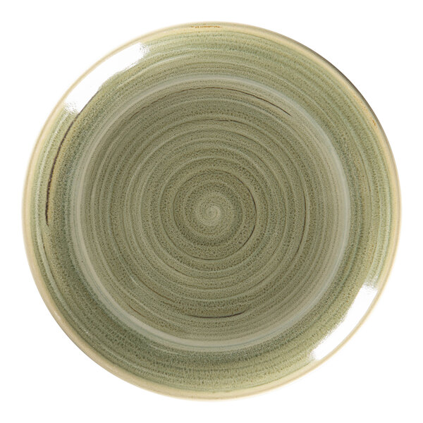 A close-up of a RAK Porcelain emerald green flat coupe plate with a spiral design.