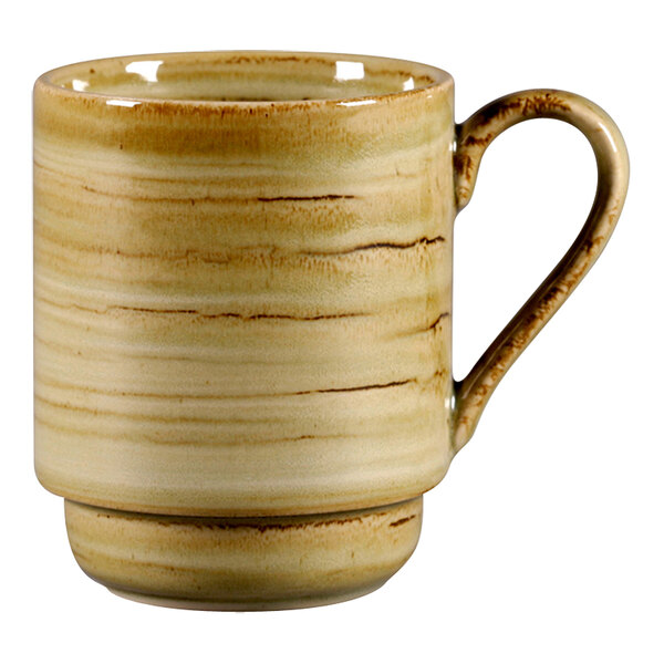 A garnet RAK Porcelain mug with a handle.