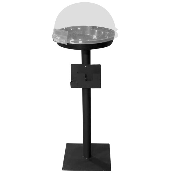 A black metal stand with a clear dome on a table.