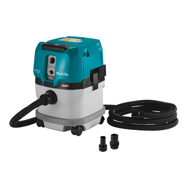 A blue and white Makita 40V Max XGT dry dust extractor vacuum with hose.