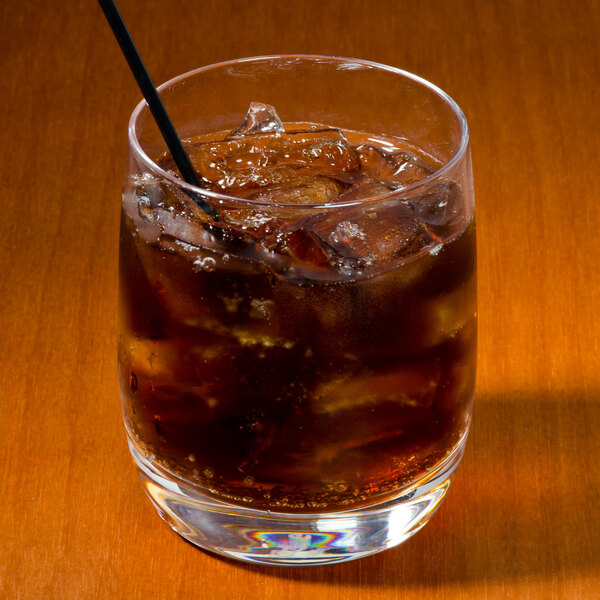 A Stolzle Weinland rocks glass with ice and cola, with a straw.