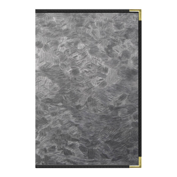 A brushed metallic steel menu cover with a black and white pattern on a metal surface.