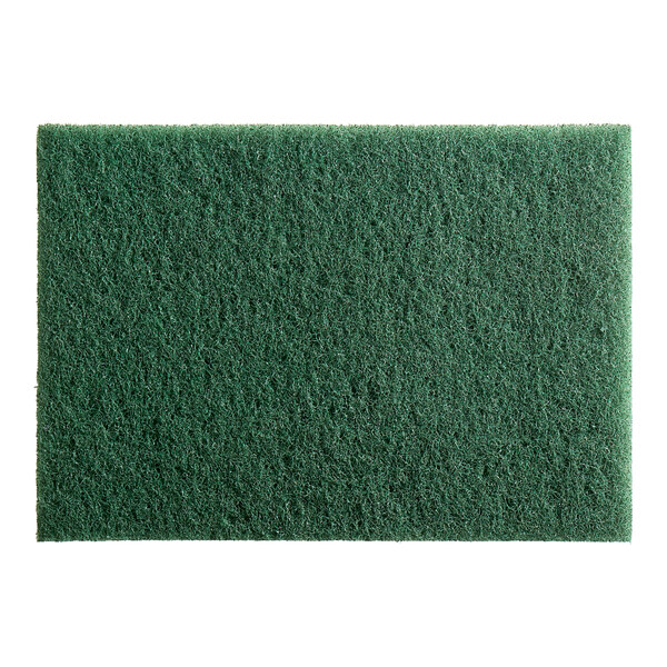 A close-up of a green Lavex scrubbing floor pad.