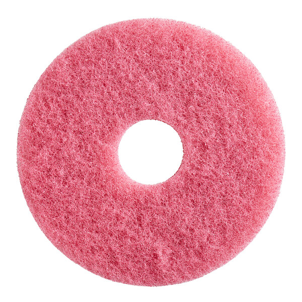 A pink circular Lavex floor machine pad with a hole in the middle.