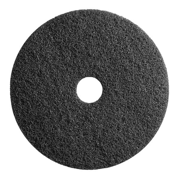 A black circular Lavex Pro stripping pad with a hole in the middle.
