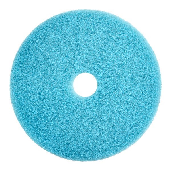 A light blue circular Lavex floor pad with a hole in the middle.