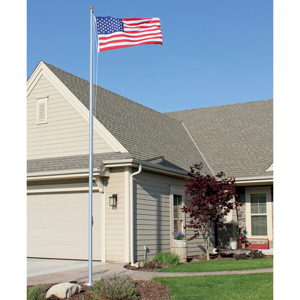 An American flag on a Valley Forge aluminum in-ground flag pole.