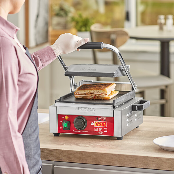 Avantco PG100ST Commercial Panini Sandwich Grill with Timer, Smooth Plates, and 8 1/2" x 8 1/2" Cooking Surface - 120V, 1750W