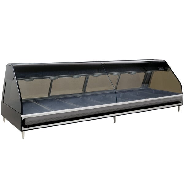 A stainless steel Alto-Shaam heated display case with curved glass on a counter.