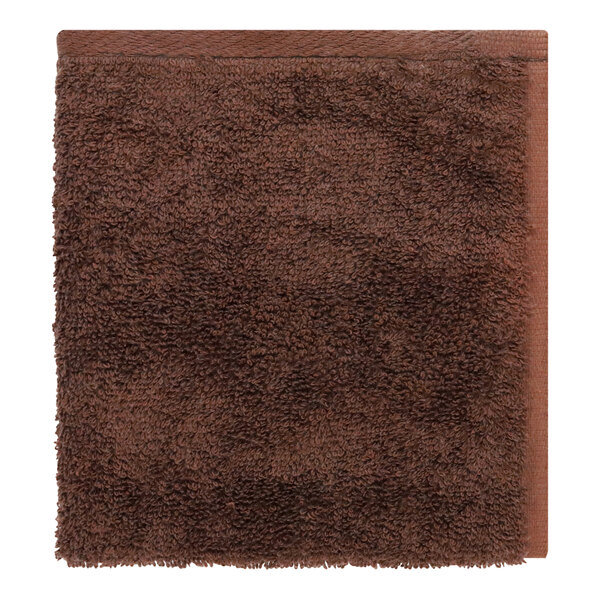 A brown 1888 Mills Millenium washcloth with a white border.