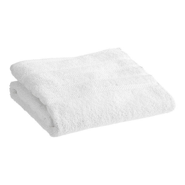 A folded white 1888 Mills Naked Terry bath mat.