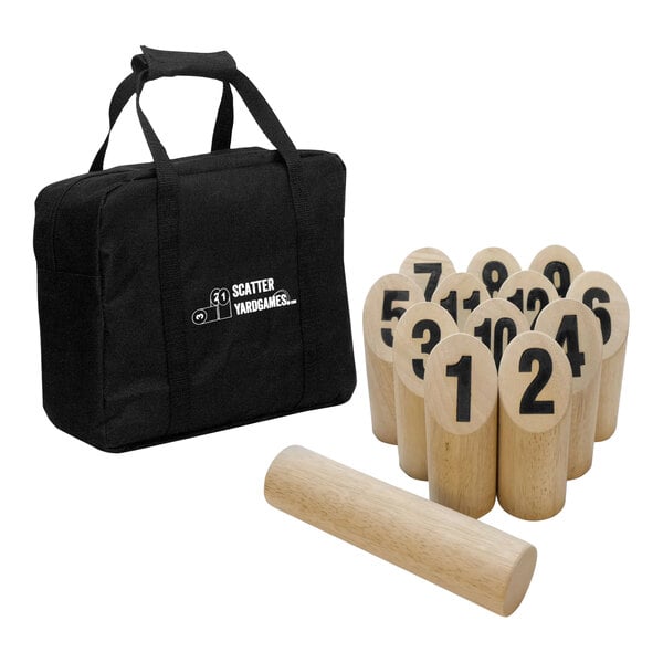 A black bag with white text containing a Yard Games Scatter Game Set with wooden objects and a bag.