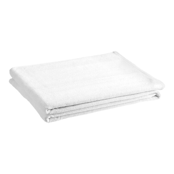 A stack of folded white 1888 Mills Aura spa towels on a white background.