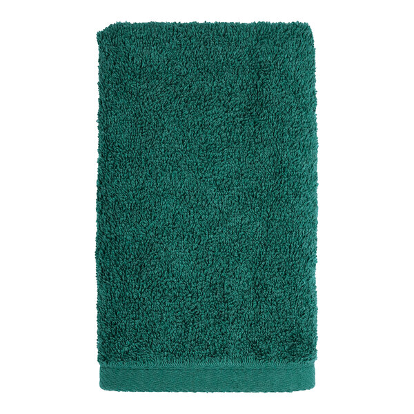 A green 1888 Mills hand towel on a white background.