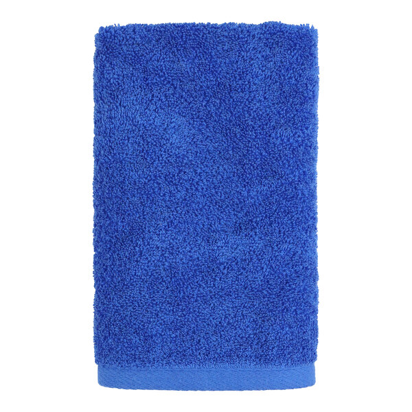 A blue 1888 Mills hand towel on a white background.