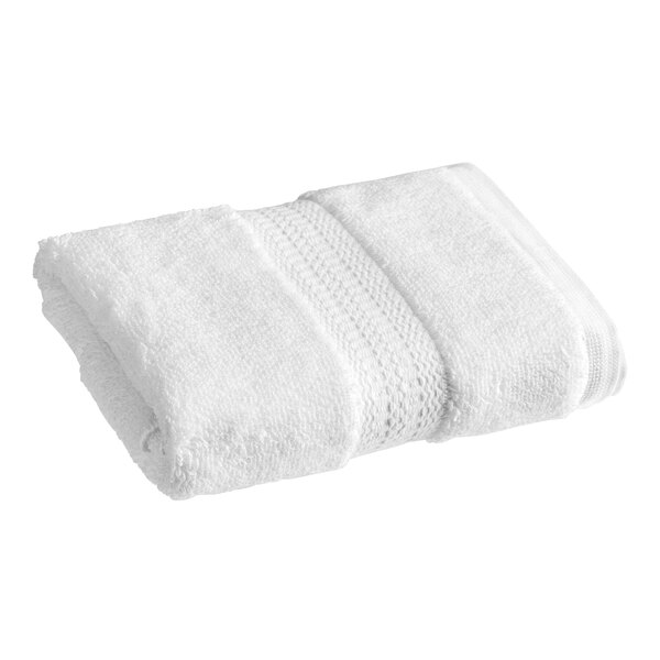 A white 1888 Mills Oasis Terry hand towel folded on a white background.