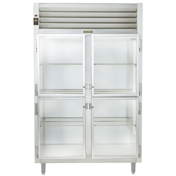 A white Traulsen glass pass-through holding cabinet with glass doors.