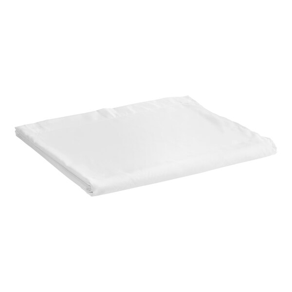 A white folded 1888 Mills Flourish microfiber flat sheet on a white surface.