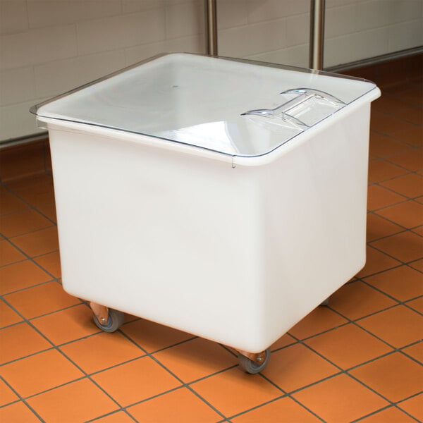 A white Cambro ingredient storage bin with a sliding lid sits on a counter.