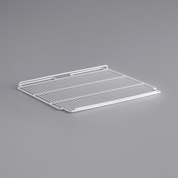 A white wire rack on a gray background.