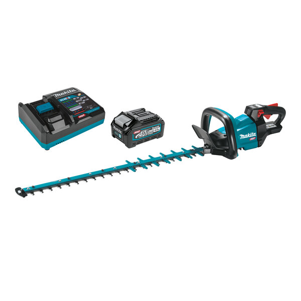 A close-up of a blue and black Makita cordless hedge trimmer with a black battery and blue and black battery charger.